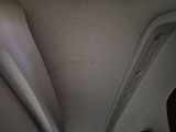 a view of the inside of a car from the passenger seat