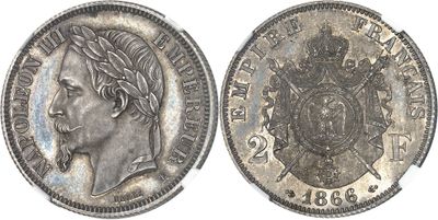 a close up of a silver coin with a crown on it