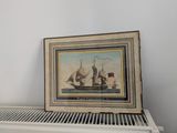une photo d'un tableau posé sur un radiateur, à côté d'un radiateur