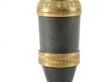 a black and gold vase on a gold stand