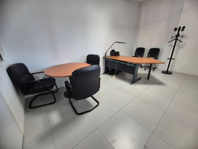 an image of a conference room with a table and chairs