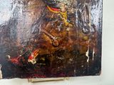 a painting of a man riding a horse on a easel