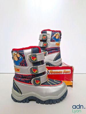 the children ' s snow boots are lined up and ready to be worn