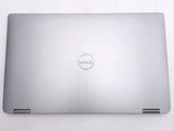 dell laptop computer sitting on top of a table with a white background