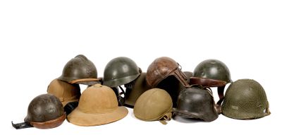 a lot of helmets that are sitting on a white surface