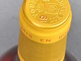 a close up of a bottle of liquor on a table