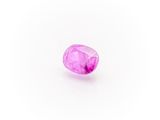 a pink sapphire stone on a white background