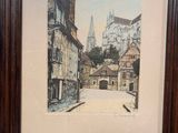 framed picture of a street scene with a church in the background