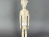 an image of a statue of a person with a tag on it ' s chest
