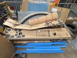 a pile of boxes and pipes in a warehouse