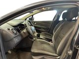 the interior of a car with the door open showing the driver ' s seat area