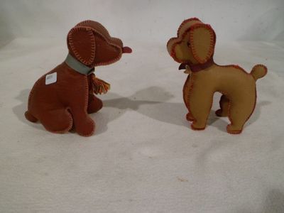 two toy dogs that are sitting next to each other