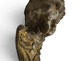 bronze bust of a young boy with his head turned to the side
