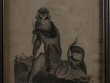 an old picture of a monkey and a monkey sitting on a rock