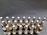 a bunch of bottles of wine sitting on top of a table