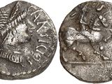 a silver coin with an image of a horse on it
