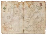 an old book with a map of the world on it