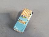 a small toy car that is sitting on the ground