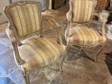 two chairs that are sitting next to each other on the floor