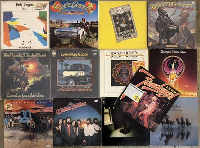 a lot of different album covers on the wall