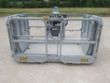 an image of a large metal work platform in the middle of a parking lot