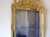 a mirror hanging on the wall in a room