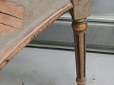 a wooden bench that has a wooden seat on top of it