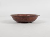 a brown bowl sitting on top of a white surface