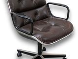 brown leather office chair with black metal frame and casteors