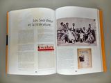 an open book with a picture of a group of people on it