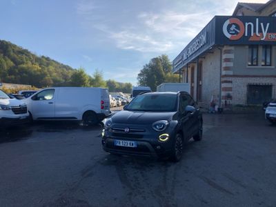the car is parked in front of the building with other cars parked in front of it