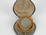 an image of a box with a ring inside of it on a white surface