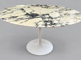 an image of a marble table with a white base and a black and white marble top