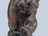statue of a monkey holding a baby in its arms