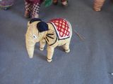 a small toy elephant that is standing on the floor