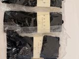 six pairs of men ' s socks in plastic bags on a white surface