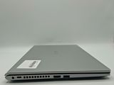 an open laptop computer sitting on top of a white table