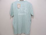 a t - shirt hanging on a hanger on a wall