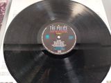 vinyl record with the police on it sitting on a table