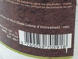 a close up of a bottle of liquid with a barcode on it