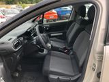 the interior of a car with the door open and the driver ' s seat down