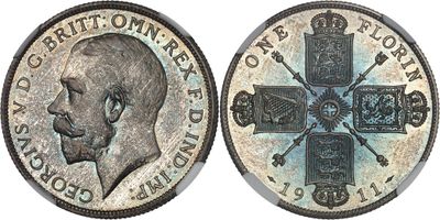 a close up of a coin with a cross on it