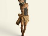 an old statue of a man with a cross on a white background