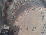 a close up view of a rusted engine on a train