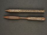 an image of two wooden pencils sitting on top of a table