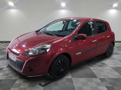 a picture of a red car parked on a checkered floor