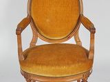 an image of a chair with a yellow upholstered seat