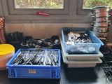 many containers of silverware on the counter in the kitchen
