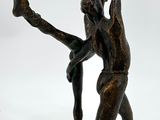 bronze statue of a man and a woman holding each other ' s hands