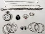 a lot of jewelry that is laying out on the table